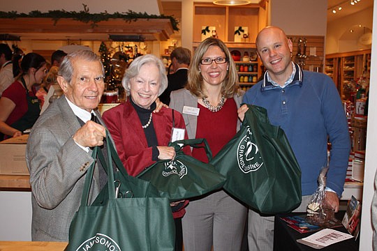 Photos by Joe Wilhelm Jr. - Holland &amp; Knight of counsel Dan Coffman, Blanche Coffman, Holland &amp; Knight associate and a local organizer of the event Kim Law and John Law.