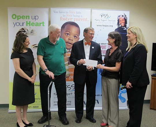 Neviaser Charitable Foundation Vice President Nancy Neviaser Baker presented a $100,000 donation to Dr. George Armstrong, Family Support Services president. Looking on is (from left) Lydia Russo, FSS board member; Michael Neviaser, foundation presiden...