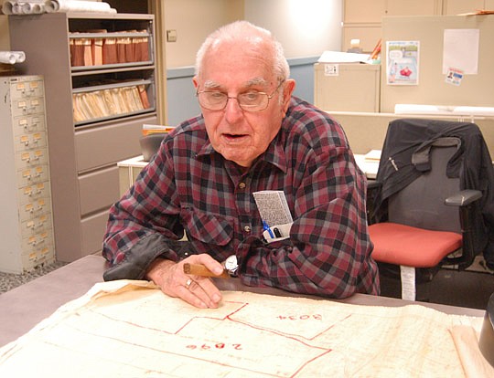 Photo by Max Marbut - Five days a week before the sun came up, Rountree was at the counter in the survey office to answer questions about property lines and rights of way.