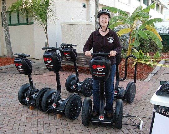 Photo by Max Marbut - Maureen Kearns has a small fleet of Segway personal transporters for rent at the Landing.