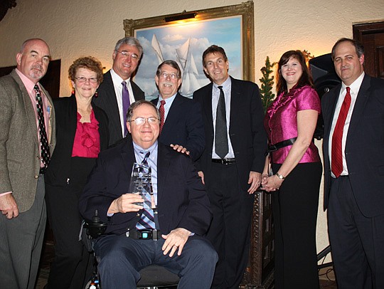 Photos by Joe Wilhelm Jr. - Douglass Myers (center), assistant general counsel for the City of Jacksonville, was awarded the E. Robert Williams Inn of Court John J. Schickel Professionalism Award Wednesday at Epping Forest Yacht Club. He is joined by ...
