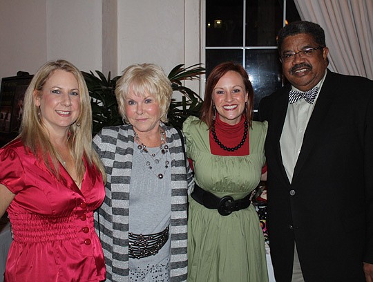 Photos by Joe Wilhelm Jr. - From left, Elisa DeWolf, Darlyne Crummitt, Merry Charity founder Maggie Jo Hilliard and Ken Amaro, reporter for WTLV TV-12 and WJXX TV-25, who served as master of ceremonies.