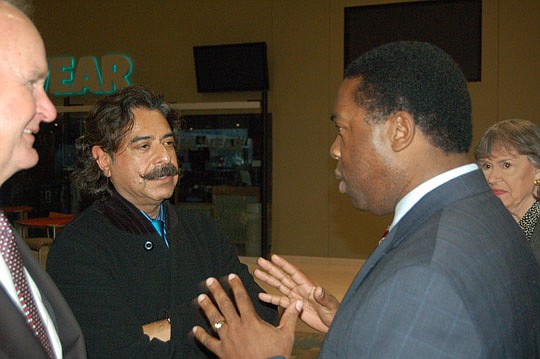 Photo by Max Marbut - Mayor Alvin Brown (right) speaks with new Jacksonville Jaguars owner Shahid Khan at a media event Friday at EverBank Field. Wayne and Delores Barr Weaver, who are selling the team, look on from the left and right.