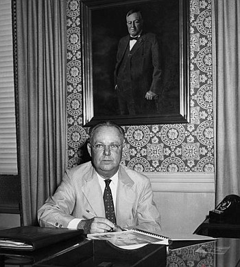A portrait of James R. Stockton in front of a portrait of his father, Telfair Stockton, seated at his desk in the old Atlantic Bank Building Downtown. James Stockton acquired most of the property in Ponte Vedra from National Lead Co. in the 1940s. He ...