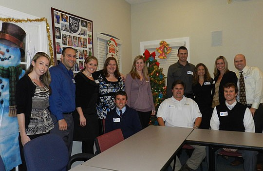Members of the Dreams Come True Horizon Board gather around the Christmas tree for a group picture following their Christmas for Dreamers party. From left, Kara Donahue, Jason Loccisano, Heather Lane, Andrea Siracusa, Bryan Russell, Summer Stewart, Wi...