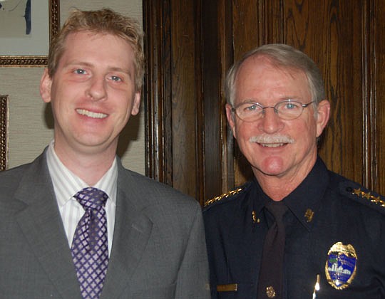 Photos by Max Marbut - Downtown Council President Jonathan Smith and Sheriff John Rutherford, who was the speaker Friday at the club's first meeting of 2012.