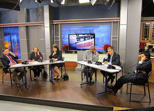 During a First Coast News program, local pro bono attorneys advise callers. Shown are Greg Gilbert, Laura Boeckman, Raye Blair, Greg Jackson, James Young and Alessandro Apolito.
