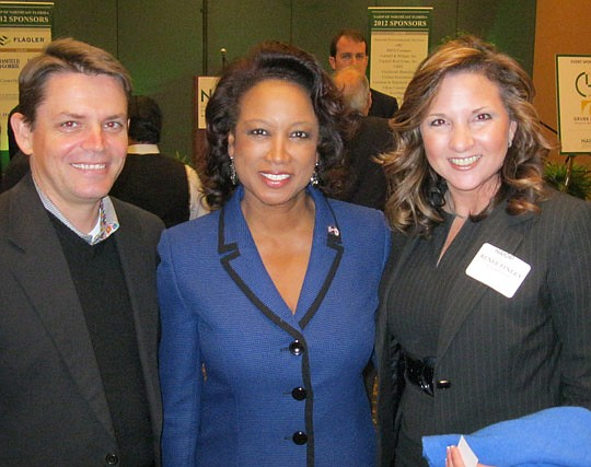 Photos by David Chapman - Lt. Gov. Jennifer Carroll (center) was in town Friday to speak to NAIOP members and guests including City Council member Richard Clark (left) and Renee Finley, Mayor Alvin Brown's director of Public-Private Partnerships.