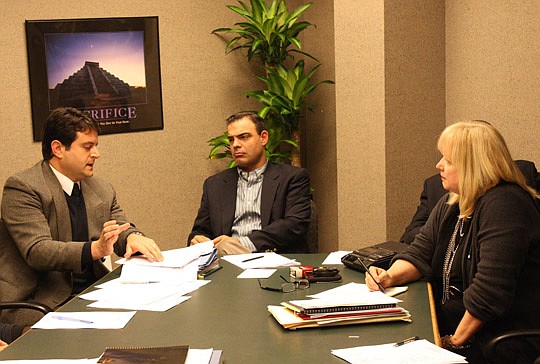 Photo by Joe Wilhelm Jr. - From left, Assistant General Counsel Jason Gabriel discusses the issue of funding the new Office of Ethics, Compliance and Oversight with Ethics Commission Chairman Braxton Gillam and Carla Miller, the director of the Office...