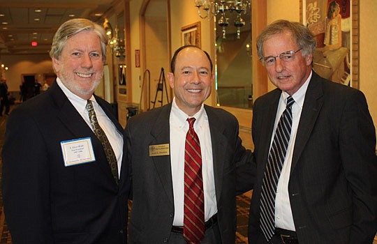 Photos by Joe Wilhelm Jr. - From left, The Florida Bar Board of Governors member Grier Wells, who represents the Fourth Circuit, President Scott Hawkins and former President Hank Coxe at The Jacksonville Bar Association meeting Friday at the Hyatt Dow...