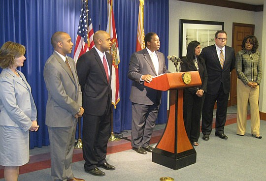 Photo by David Chapman - Mayor Alvin Brown (middle) made seven appointments to the City on Tuesday. They include (from left) Kelly Boree, parks and recreation director; Brian Clarke, City ombudsman; Twane Duckworth, City risk manager, Usha Mohan, info...