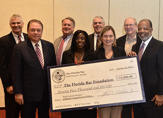 The Trial Lawyers Section of The Florida Bar presented a $75,000 check Jan. 26 to The Florida Bar Foundation. From left: Ted Eastmoore, Trial Lawyers Section treasurer; Stephen Zack, immediate past president of the American Bar Association and former ...