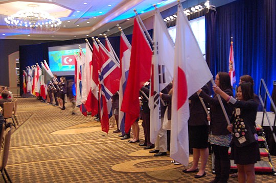 Photos by Max Marbut - Monday's celebration of the first 100 years of the Rotary Club of Jacksonville began with a procession of flags from countries around the world carried by Rotary Youth Exchange Students.