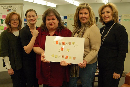 Photo by Max Marbut - From left, Jacksonville Public Library Literacy Program Assistants Katie Devanny and Kat Minor, Literacy Program Manager Sharon Jaskula, incoming Community Connections President and CEO Lelia Duncan and Learn to Read Inc. interim...