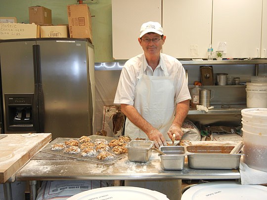 David Unkelbach was making apple fritters this morning at The Donut Shoppe in Arlington. He plans to move the business down the street this spring.