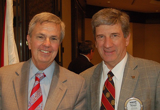 Rotary Club of Jacksonville member Michael Fisher and club President Howard Dale. Fisher's father, Prim, was president of the club 50 years ago when the organization celebrated its golden anniversary.