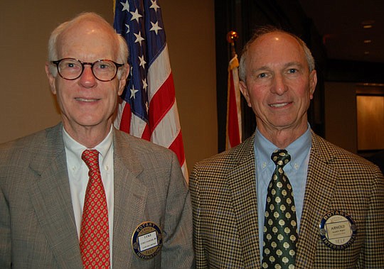 Photos by Max Marbut - Rotary Club of Jacksonville members Luke Sadler and Arnold Rogers. Rogers told the club Monday why the price motorists pay at the gas pump can change daily.