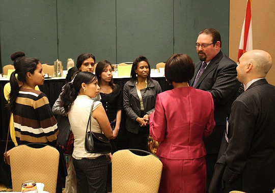 CdeBaca talks with a group of students involved with Florida State College at Jacksonville's Scholarships for Education and Economic Development Program International program.