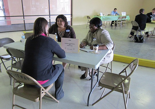Pro bono attorneys Jamie Ibrahim and Kim Clayton provide legal guidance at the "Ask-A-Lawyer" event March 3.