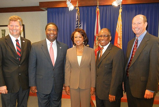Photos by Karen Brune Mathis - From left, Joost, Brown, Carroll, district City Council member Warren Jones and Mallot at the Monday morning news conference at City Hall.