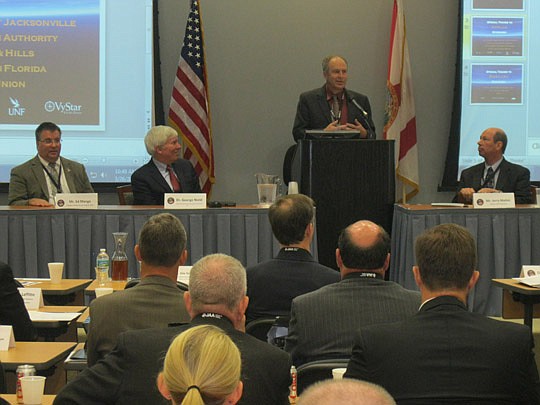 Steve Grossman, Jacksonville Aviation Authority executive director, participates in a panel discussion Monday at the Cecil Spaceport Development Summit. He was joined by Ed Mango, NASA Commercial Crew Program program manager, George Nield, Federal Avi...