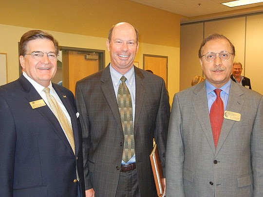 Photo by Karen Brune Mathis - Economic Roundtable of Jacksonville keynote speaker Jerry Mallot (center) with Madison Shelly (left), director of donor relations in institutional advancement at Jacksonville University, and Hassan Pordeli, Hugh Culverhou...