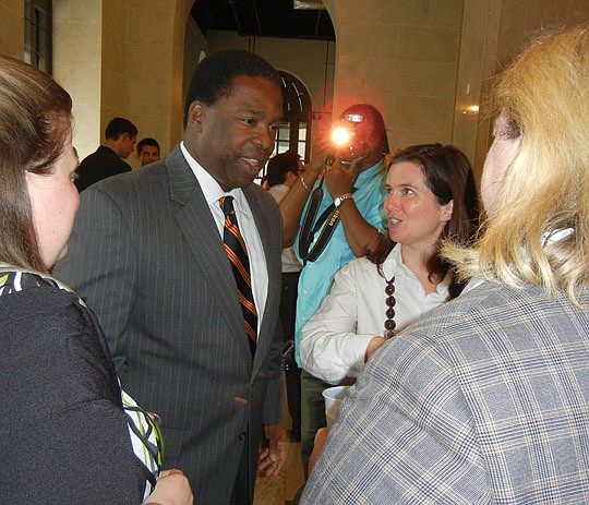 Mayor Alvin Brown met with about 100 young professionals, including Jennifer Chapman (right), Thursday night at The Carling Downtown.