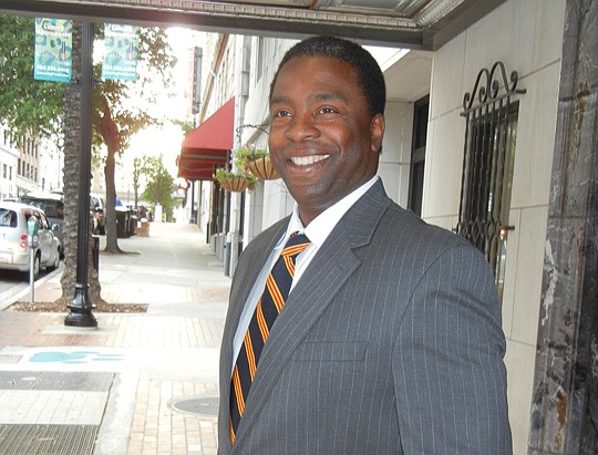 Photo by Karen Brune Mathis - Mayor Alvin Brown stopped for a photo last week outside The Carling Downtown after presenting his economic-development vision to a group of young professionals. He has proposed legislation for a Downtown Investment Author...