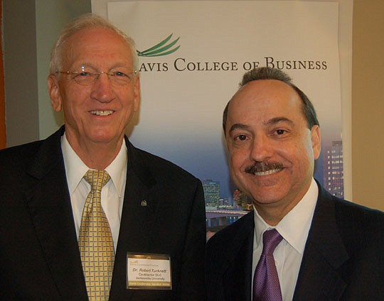 Photo by Max Marbut - Robert Turknett, co-director of the Davis Leadership Center at Jacksonville University, with AT&amp;T Mobility President and CEO Ralph de la Vega.