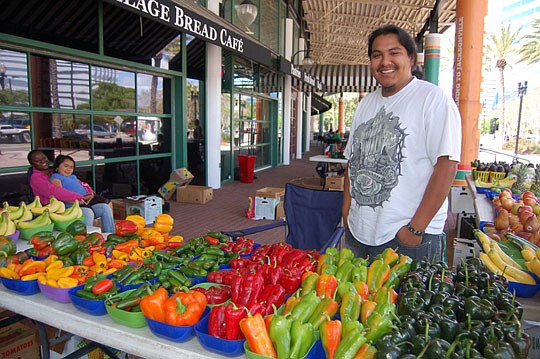 Photos by Max Marbut - Lupe "Smokey" Baltierra brought fresh fruit and vegetables from South Florida to the Jacksonville Landing Market Friday. He's a fourth generation vegetable vendor.