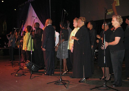 Photos by David Chapman - A chorus composed of Southside Baptist Church, Southside Church of God in Christ and The Potter's House International Ministries performs during Friday's event.