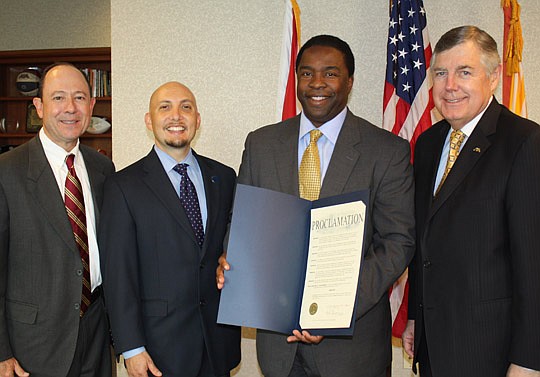 Photos by Joe Wilhelm Jr. - The Florida Bar President Scott Hawkins, The Jacksonville Bar Association President Michael Freed, Mayor Alvin Brown and American Bar Association President William Robinson with the City of Jacksonville proclamation declari...