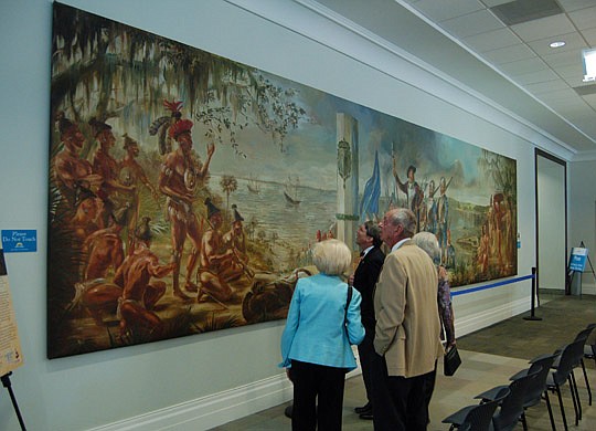 Photos by Max Marbut  - The 30-foot wide mural depicting Jean Ribault arriving on the banks of the St. Johns River was unveiled Tuesday in the Florida Collection at the Main Library. The painting is a Lee Adams original and was part of the dÃ©cor in t...