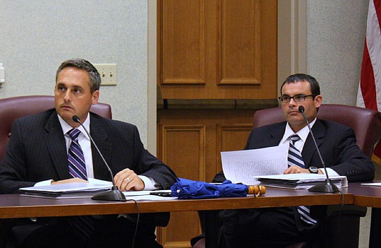 Photo by Joe  Wilhelm Jr. - From left, Ethics Commission members James Young and L.E. Hutton listen to details of proposed City Ordinance 2012-212 Monday during a meeting of the commission's Legislative Subcommittee.