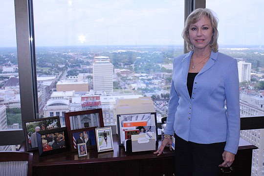 Photo by Joe Wilhelm Jr. - Weatherby can see the JEA Tower from the window of her office of the 24th floor of the Wells Fargo Center Downtown.