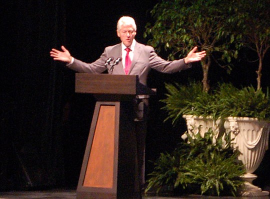 Photos by Max Marbut - Former President Bill Clinton speaks during Friday's economic summit about the need and willingness of people with different viewpoints to work together to accomplish substantial positive change. Clinton, the 42nd U.S. president...