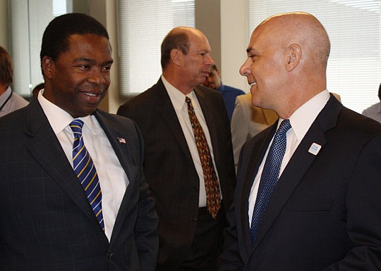 Photo by Joe Wilhelm Jr. - From left, Mayor Alvin Brown and Florida Blue Chairman and CEO Pat Geraghty spoke Wednesday before the announcement of 200 new jobs at 532 Riverside Ave. through its subsidiary Novitas Solutions. Jerry Mallot, president of J...
