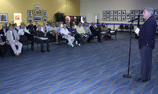 Photo by Joe Wilhelm Jr. - Jacksonville Port Authority CEO Paul Anderson (right) talks Tuesday at the Jacksonville Harbor Navigation Deepening Study public meeting about achieving a balance between economic development and environmental protection whe...