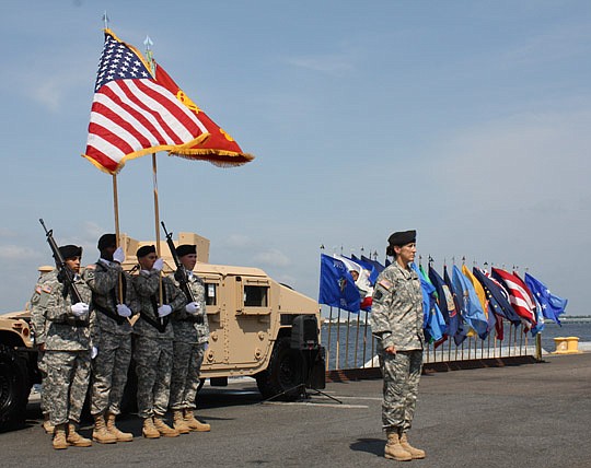 Photos by Joe Wilhelm Jr. - Lt. Col. Onintza Regil (right) is the new commanding officer of the U.S. Army 832nd Transportation Battalion. A change of command ceremony was held Tuesday at the Jacksonville Cruise Terminal at Dames Point.