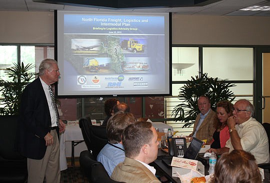Photo by Joe Wilhelm Jr. - At left, North Florida Logistics Advisory Group Chairman George Gabel, a partner with Holland &amp; Knight, welcomes about 40 people to a presentation Friday about the development of a freight, logistics industry and infrast...