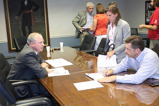 Photo by Joe Wilhelm Jr. - Retired U.S. Navy Capt. Aaron Bowman, now BAE Systems Southeast Shipyards director of business operations, discusses budget estimates for the operation of the St. Johns River Ferry by the City's St. Johns River Ferry Commiss...