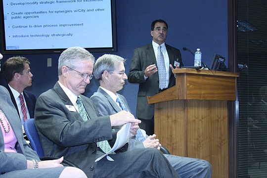 Photo by Joe Wilhelm Jr. - Incoming JEA CEO and Managing Director Joseph Belechak presents his vision of the future of JEA to the board of directors Tuesday while current CEO and Managing Director Jim Dickenson, sitting next to Deputy General Counsel ...