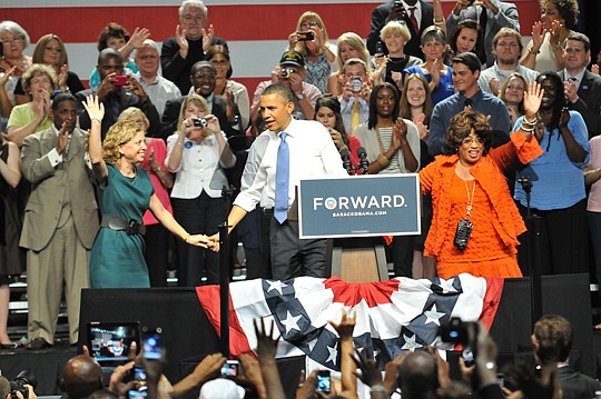 Photo courtesy of Tonya Austin - President Barack Obama joins hands with U.S. Reps. Debbie Wasserman Schultz (left) and Corrine Brown following his speech Thursday at the Osborn Center.