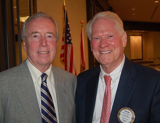 Photos by Max Marbut - Attorney George Gabel (right) introduced Frank Denton, editor of The Florida Times-Union and Morris Communications vice president for journalism, Monday at the meeting of the Rotary Club of Jacksonville.