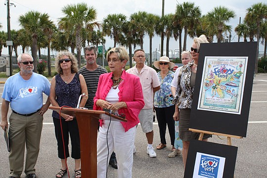 Photo by Joe Wilhelm Jr.  - St. Johns River Ferry Task Force Chair Elaine Brown (at podium) discusses the task force's disappointment Tuesday with the Florida Department of Transportation decision to not contribute to funding the ferry. She said the g...