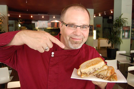 Photo by Max Marbut - Olio owner and chef Greg DeSanto with his popular duck grilled cheese sandwich, a contender for "Best Sandwich in America."