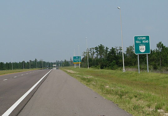 Photo by Joe Wilhelm Jr. - The FDOT has studied Branan Field-Chaffee Road as a toll road since the 1980s with signs notifying motorists of the expressway's future.
