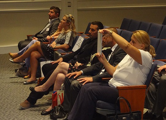 Photo by David Chapman - Members of the Serbian delegate attended the City Council meeting and were recognized before the meeting started.