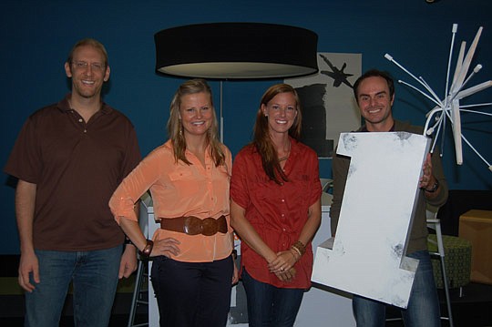 Photo by Max Marbut - The One Spark team, from left: Vince Cavin, director of operations and finance; Inka Joensuu, director of marketing; Laura Phillips, director of events and field operations; and Elton Rivas, executive director.