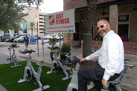 Photos by Max Marbut - JAX Chamber Director of Downtown Engagement Tony Allegretti pedals a stationary bike at the